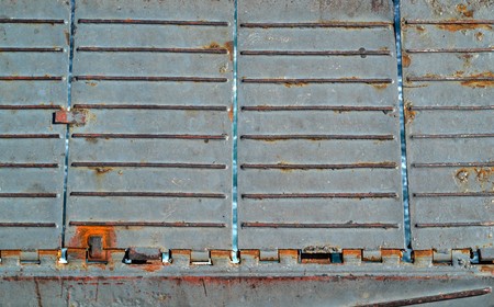 background and abstract texture of an old and rusty iron ladder closeupの写真素材
