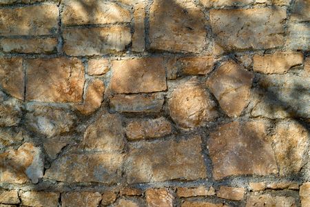 ancient stone wall or ruins for the vintage textured background closeupの写真素材