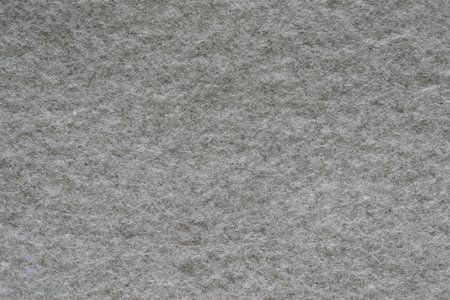 textural background or wallpaper of soft wadded fabric or textile material of gray colorの写真素材