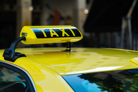 symbol of the taxi closeup in the foregroundの写真素材