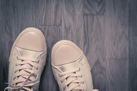 one pair of glamourous fashionable footwear in sports style closeup on an abstract background of an...