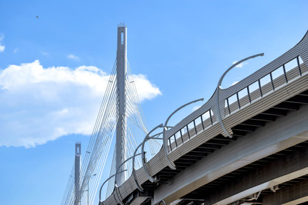 the big and modern cable-stayed bridge in St. Petersburg against the background of the cloudy sky...