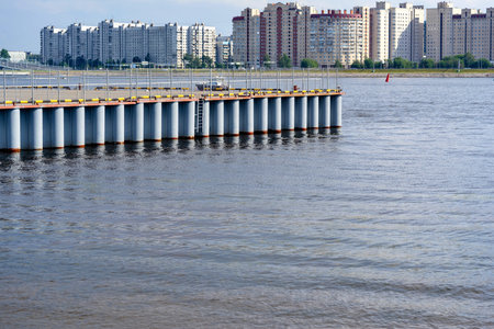 part of the pontoon platform on the river for landing of helicopters against the background of a water city landscapeの写真素材