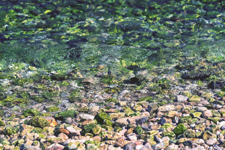 abstract stony texture closeup on an indistinct background of a sea surf for a natural landscape...