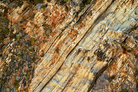 abstract corrugated texture of the stony rock closeup for an abstract natural backgroundの写真素材