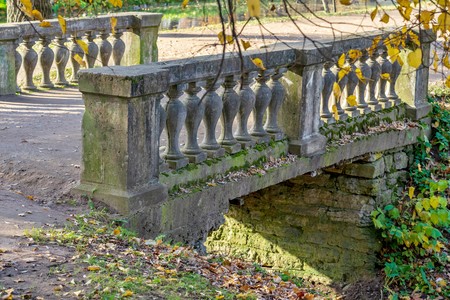 old and ancient stone the bridge for pedestrians in the parkの写真素材