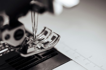 fragment of the mechanism of the sewing machine with a needle closeup of monochrome toneの写真素材