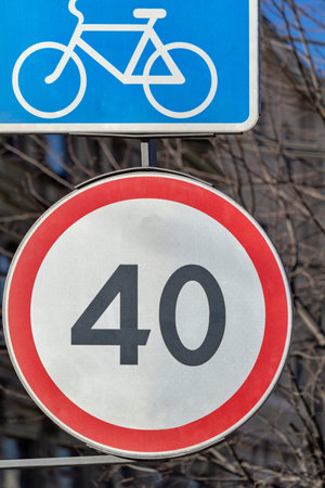 road signs of restriction of speed and strip for cyclists closeup on a front background