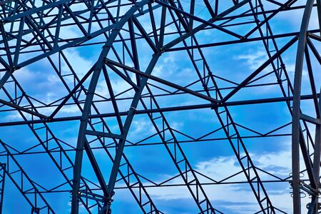 Abstract metal structure closeup against the background of blue skyの写真素材