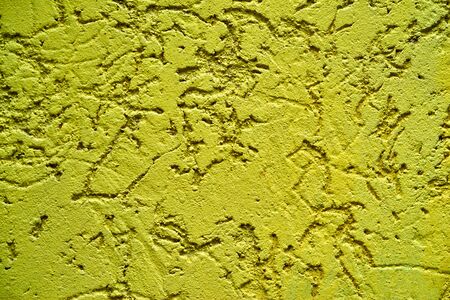 Abstract rough plastered surface for textured background or for wallpaper of yellow lemon colorの写真素材
