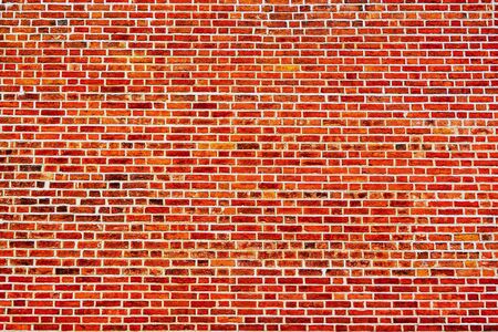 part of an empty and clean old red brick wall for abstract textured background or for wallpaperの写真素材