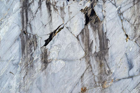 abstract texture of the shattered surface of stone or marble for a closeup backgroundの写真素材
