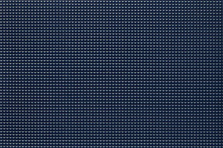 granular corrugated texture with small convex pyramids or teeth of regular square shape arranged symmetrically and in even order in horizontal and vertical rowsの写真素材