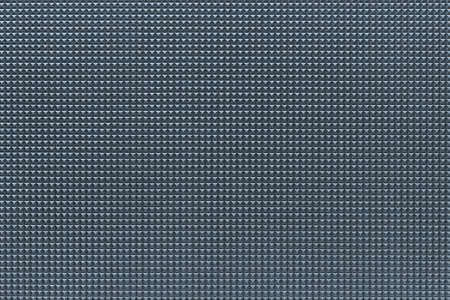 granular corrugated texture with small convex pyramids or teeth of regular square shape for background or for wallpaperの写真素材