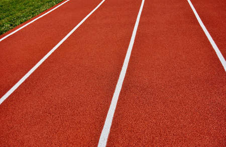 sports treadmill closeup for red background and white striped markingsの写真素材