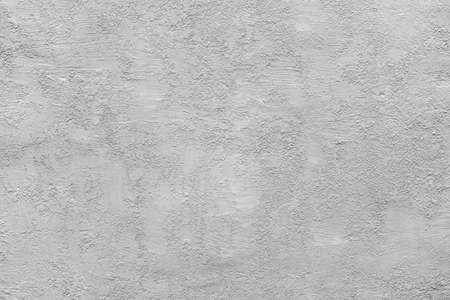 homogeneous coarse and rough texture plastered wall of light pale gray color for background or wallpaperの写真素材