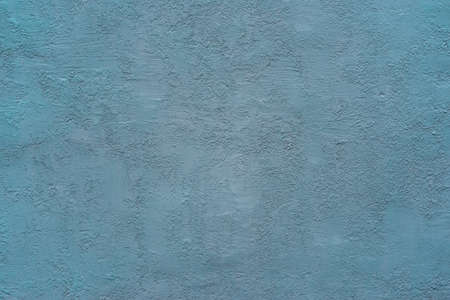 homogeneous coarse and rough texture plastered wall of blue green color for background or wallpaperの写真素材