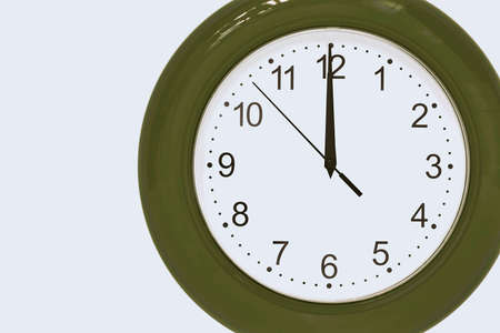 large of green color analog clock show 12 hours at midnight or noon close-upの写真素材