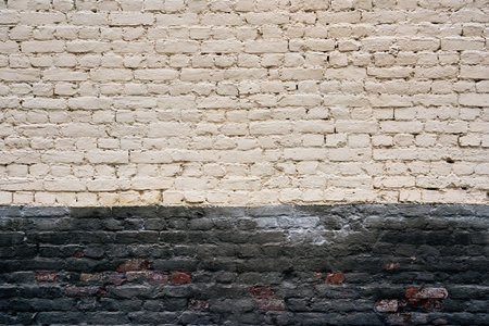 texture of painted old brick for background or wallpaper with two horizontal areas of different color surfaceの写真素材