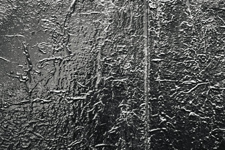 abstract old lacquered glossy surface for a textured background or wallpaper in blackの写真素材