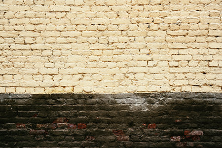 texture of painted old brick for background or wallpaper with two horizontal areas of different color surfaceの写真素材