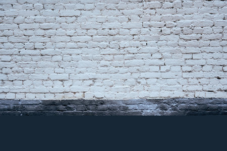texture of painted old brick for background or wallpaper with two horizontal areas of different white and blue color surfaceの写真素材