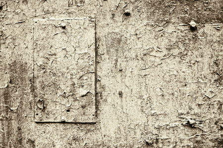 abstract old painted metal surface with patch for vintage textured background and wallpaper fo pale beige colorの写真素材