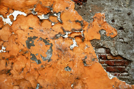 abstract part of an old brick wall with destroyed plaster for a vintage retro and loft style background and wallpaperの写真素材