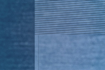 abstract geometric graphic blue background with textured parts formedの写真素材