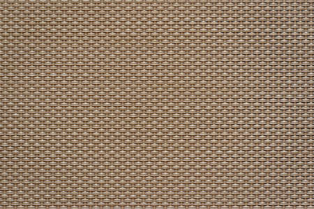 macrotexture of textile material or coarse fabric close-up with symmetric and identical mesh plexus for abstract empty background or for single-tone wallpaperの写真素材