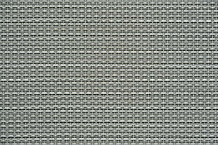 macrotexture of textile material or coarse fabric close-up with symmetric and identical mesh plexus for abstract empty background or for single-tone wallpaperの写真素材