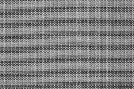 macrotexture of fabric or coarse textile material close-up with symmetric and identical mesh plexus for abstract empty background or for wallpaperの写真素材