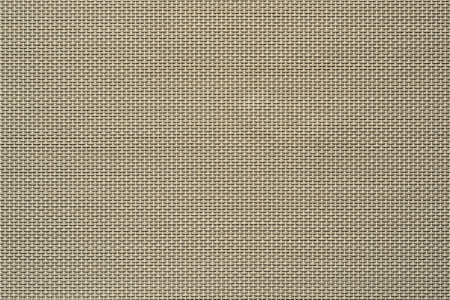 macrotexture of fabric or coarse textile material close-up with symmetric and identical mesh plexus for abstract empty background or for wallpaperの写真素材