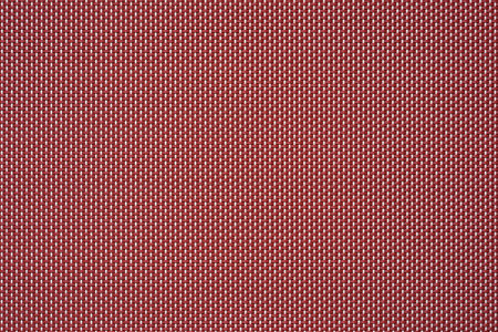 macrotexture of fabric or coarse textile material close-up with symmetric and identical mesh plexus for abstract empty background or for wallpaperの写真素材