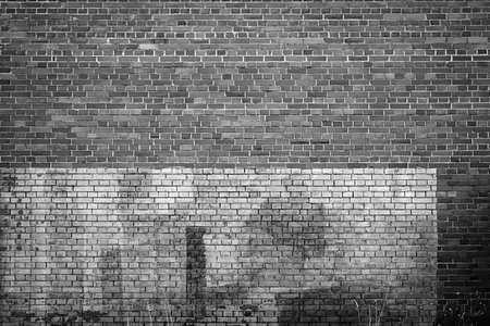 solid texture of an empty brick wall of two shades of black and white for background and wallpaperの写真素材