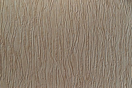 texture of textile material or fabric with winding abstract and coarse corrugated pattern for beige gray background or wallpaperの写真素材