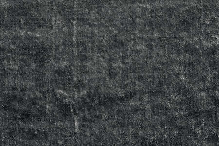 textured black and white background or wallpaper made of old velvet fabricの写真素材