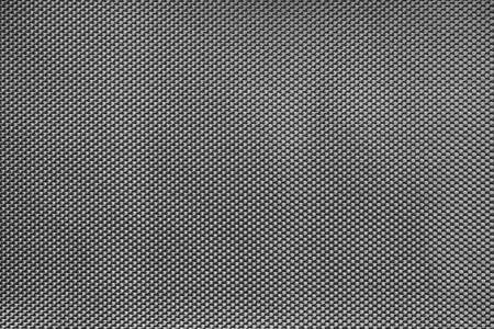 black and white textured background or wallpaper made of synthetic fabric close-upの写真素材