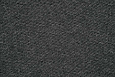 abstract mesh knitted texture for uniform dark black background or desktop wallpaperの写真素材