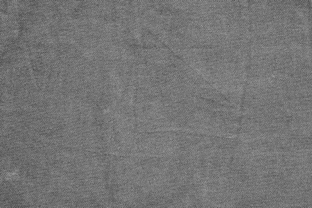 gray textured background or wallpaper of coarse cotton fabricの写真素材