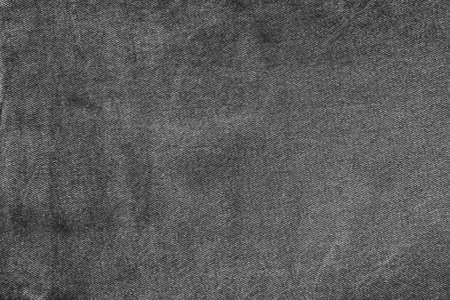 dark spotted texture of old denim in black and grayの写真素材