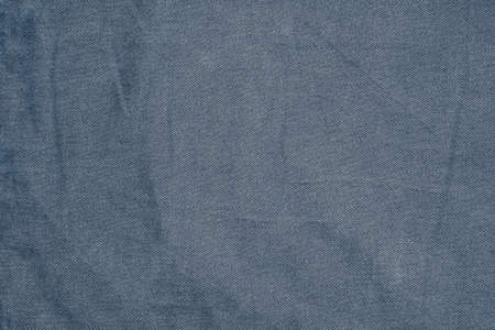textured background or wallpaper made of dark cruted cotton fabric with corrugated textureの写真素材