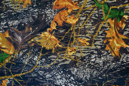 abstract seasonal floral pattern of autumn foliage on fabric for background and wallpaperの写真素材