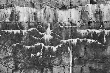 black and white abstract texture of an old concrete wall for background or wallpaperの写真素材
