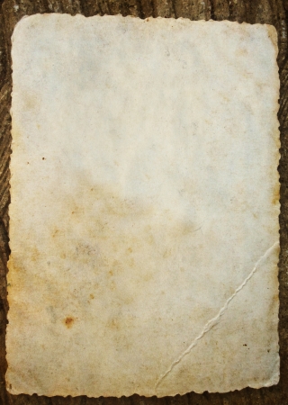 Old paper on woodの写真素材