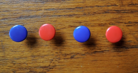 collection of various pushpins on wood  backgroundの写真素材