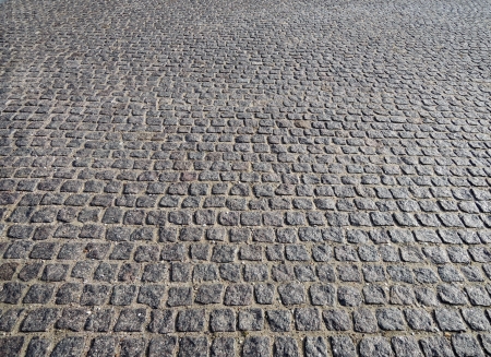 Closeup view on a cobblestone road - pattern - backgroundの写真素材
