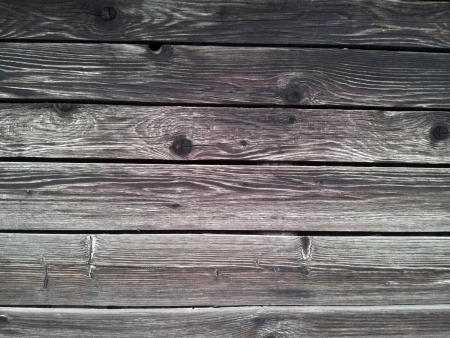 Old gray wooden wall backgroundの写真素材
