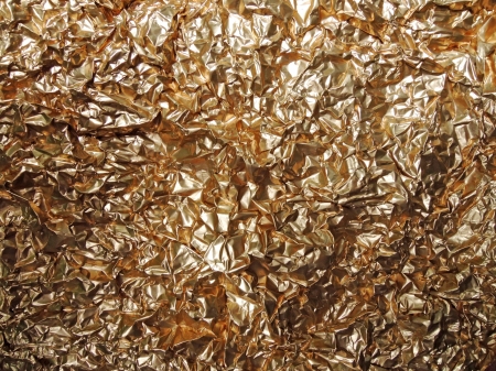 Golden aluminium foil backgroundの写真素材
