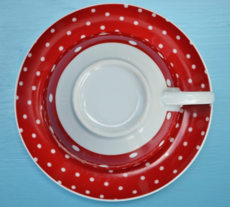 Red cup of coffee on blue backgroundの写真素材